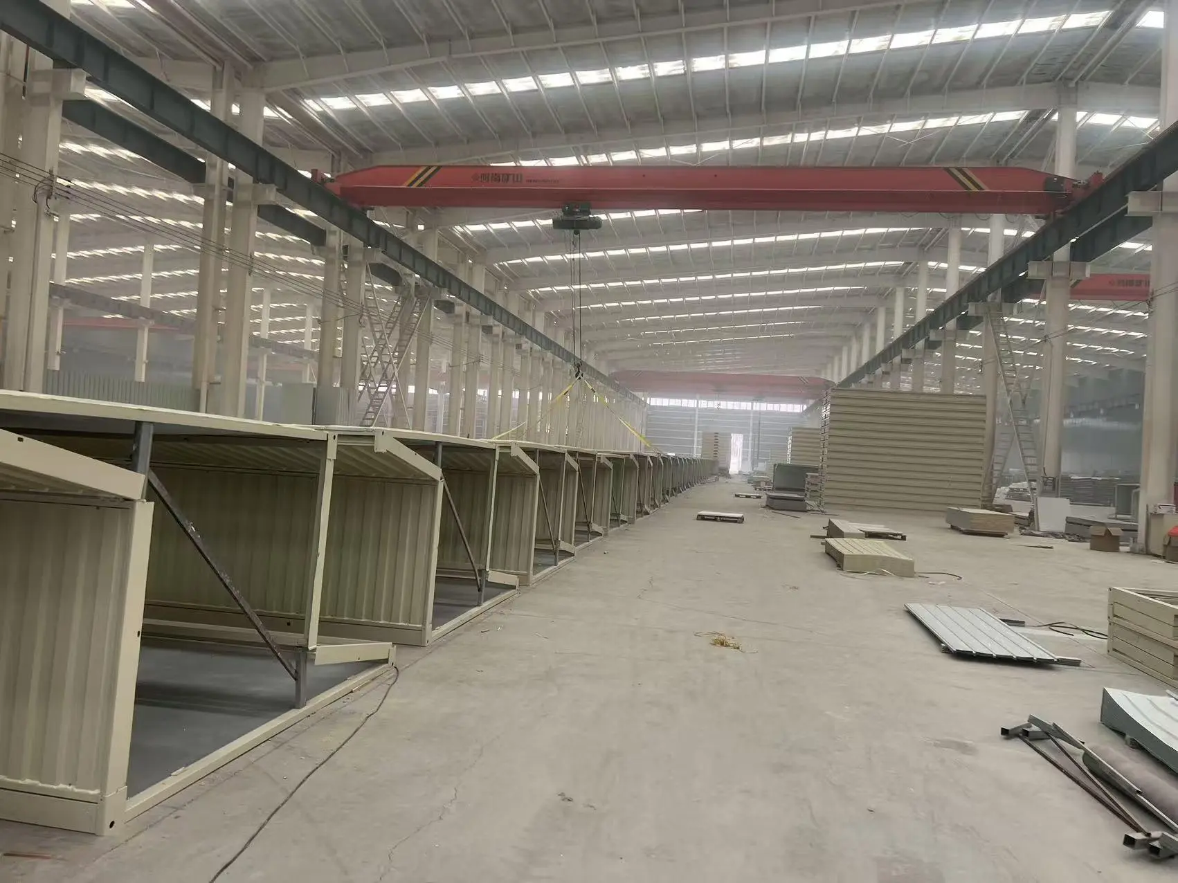 Off-site building components moving through a production line